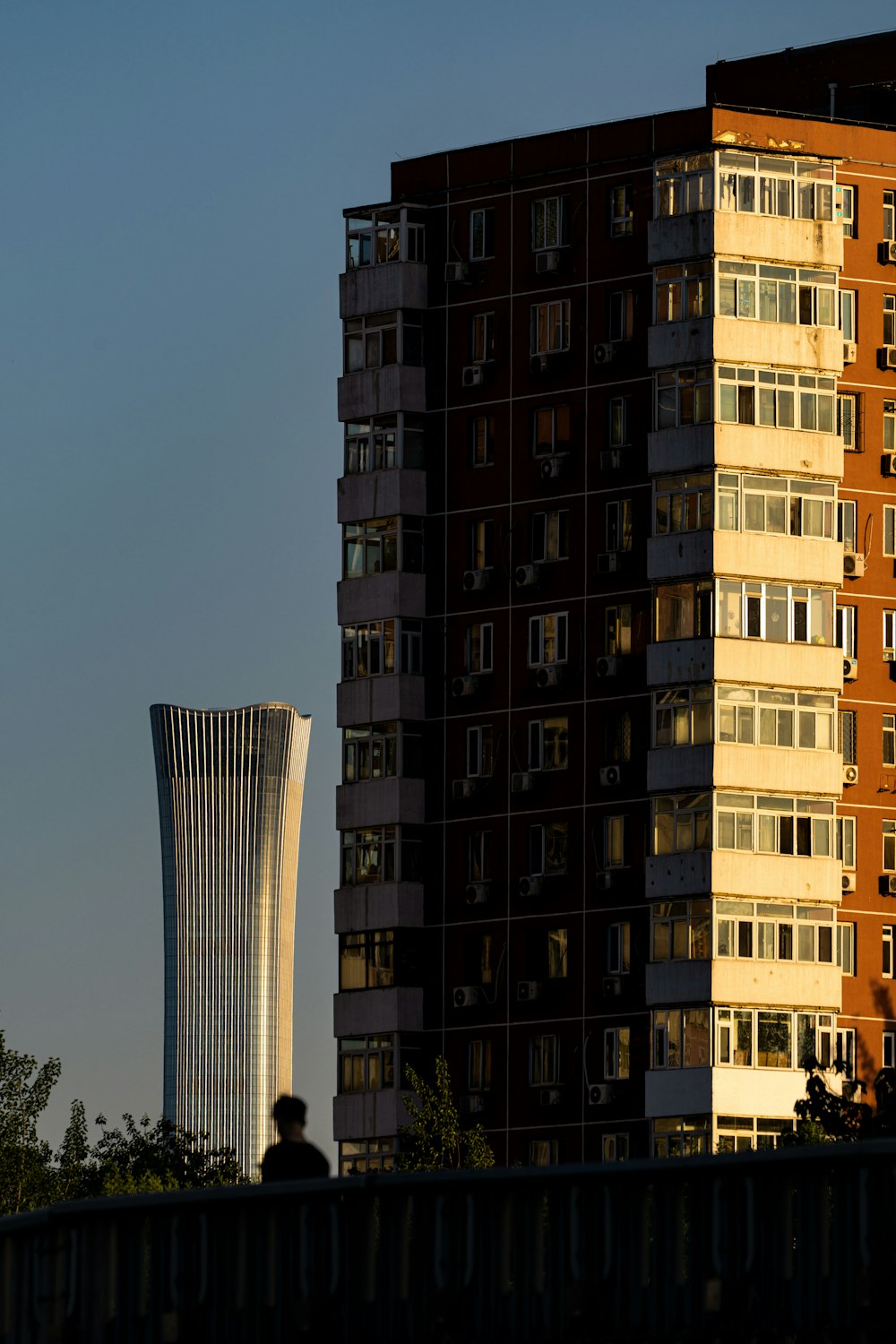 a tall building sitting next to a tall building