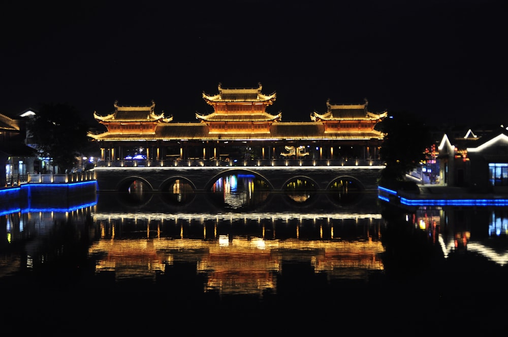 a bridge over a body of water at night