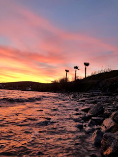 A vibrant photo from a recent vacation showing a coastal sunset with Karleen and family.