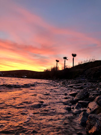 A vibrant photo from a recent vacation showing a coastal sunset with Karleen and family.