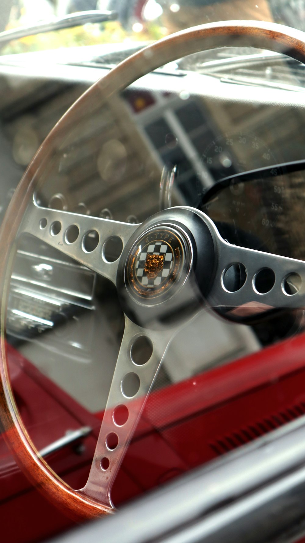 a red car with a wooden steering wheel