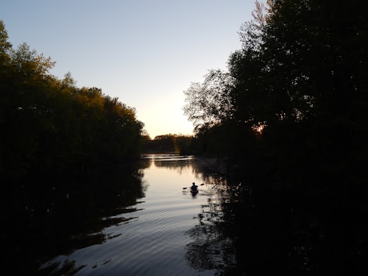 Canoe paddling on scenic Willamette River at sunset near Junction City Oregon