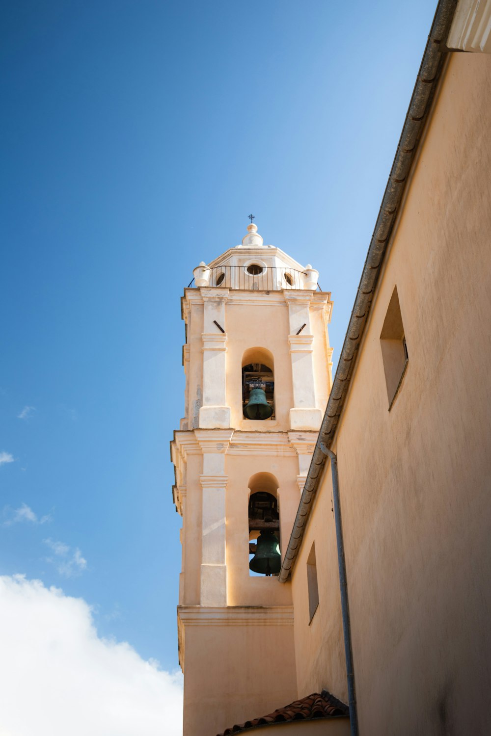 a tall tower with a bell on top of it