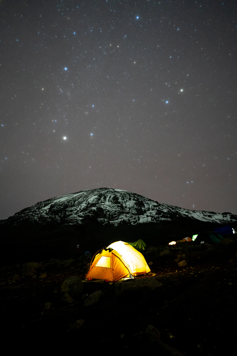 A guided camp on Mount Kilimanjaro beneath a star-filled night sky