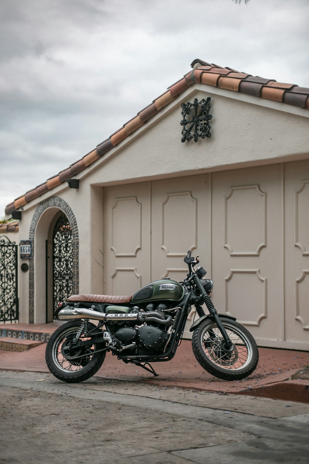 a motorcycle parked in front of a house