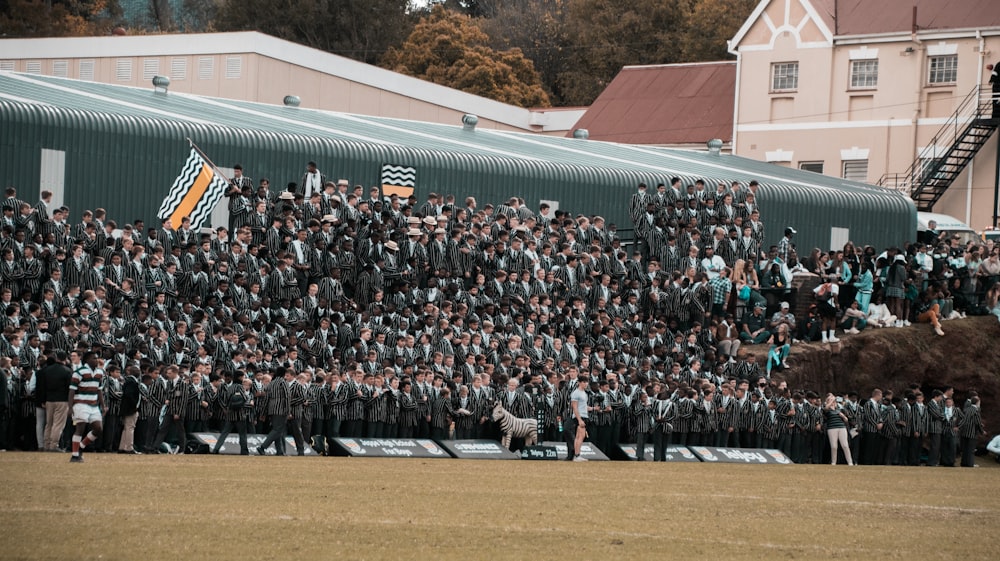 a large group of people standing in front of a building