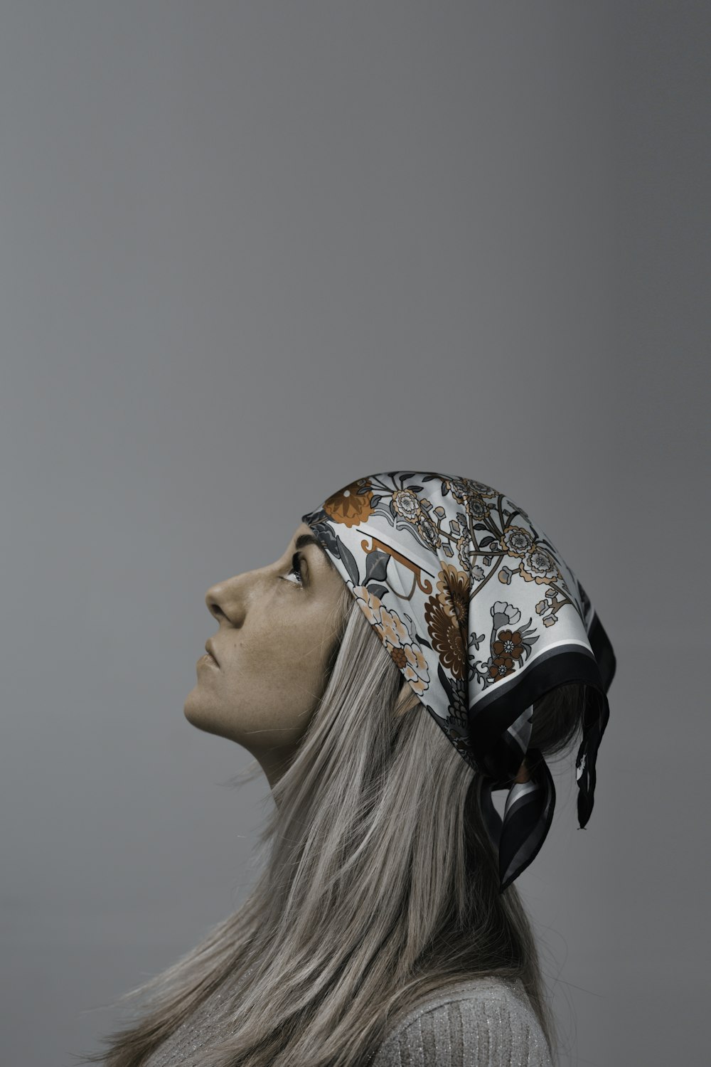 a woman with long hair wearing a helmet