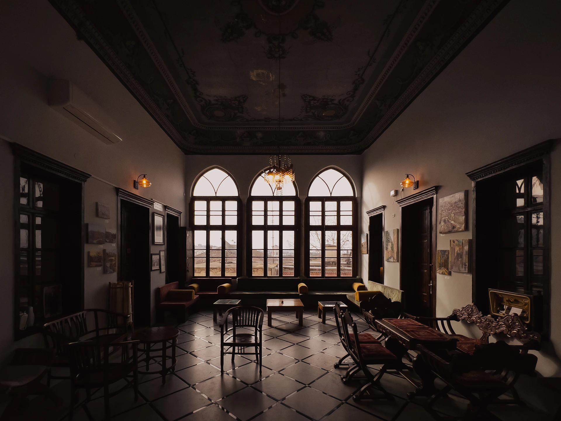 a living room filled with furniture and a large window