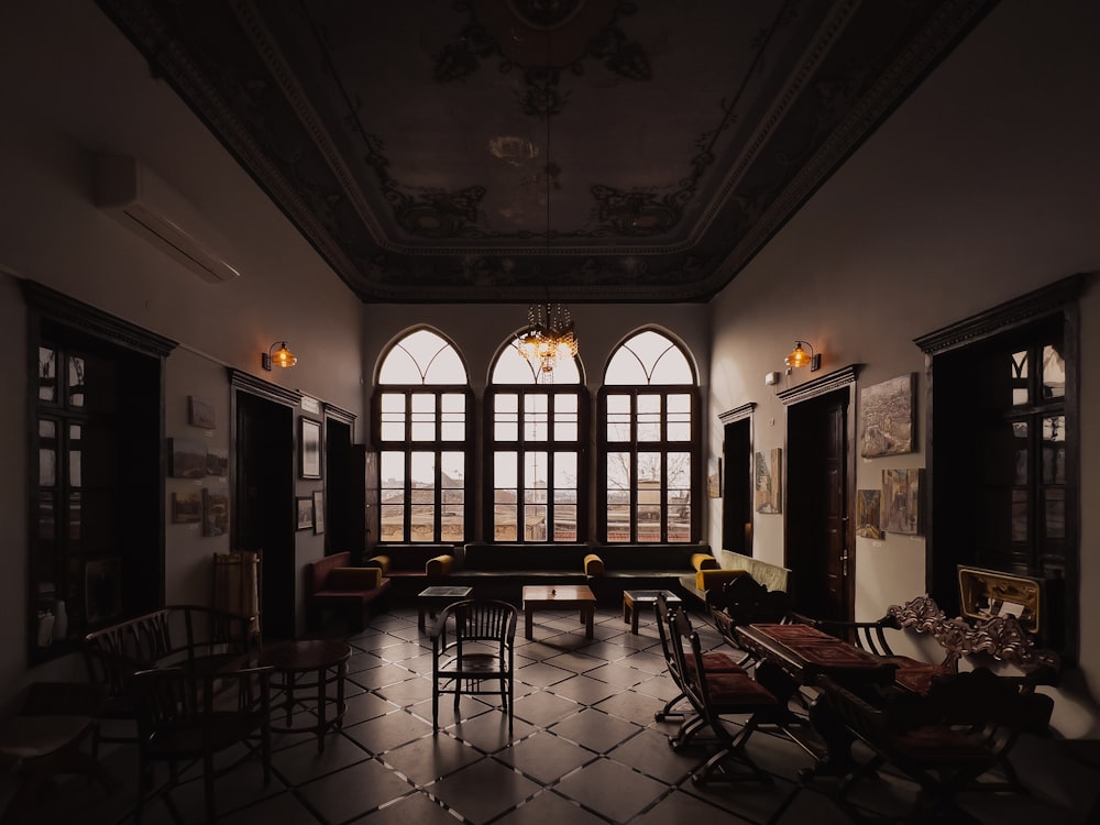 a living room filled with furniture and a large window