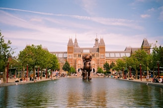 a large building with a fountain in front of it
