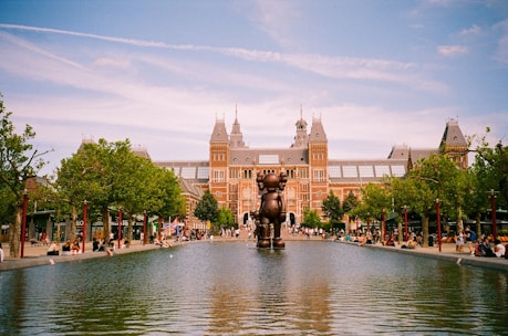 a large building with a fountain in front of it