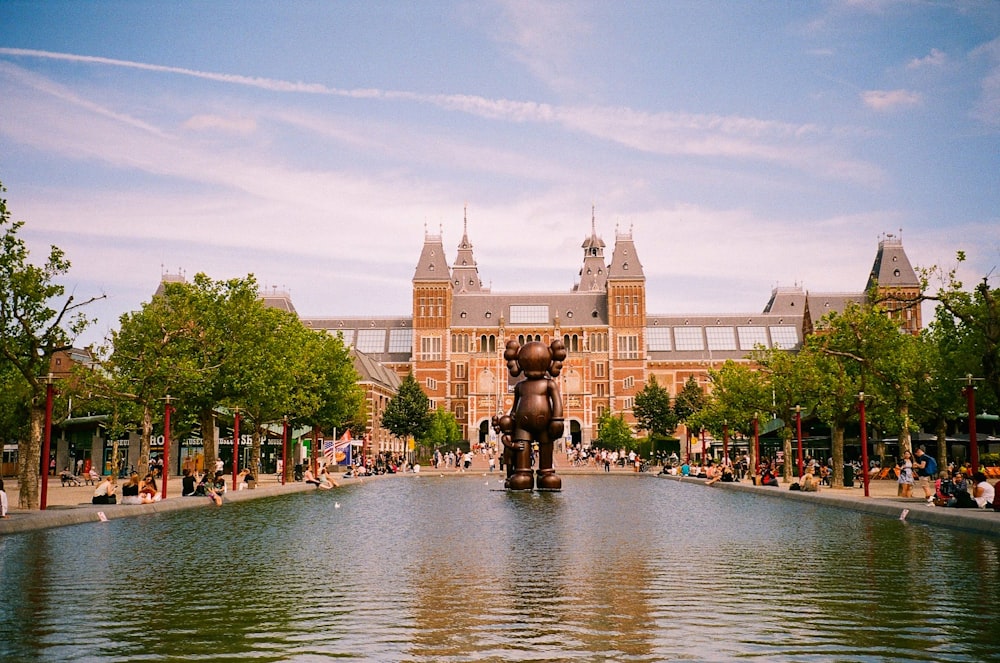 a large building with a fountain in front of it