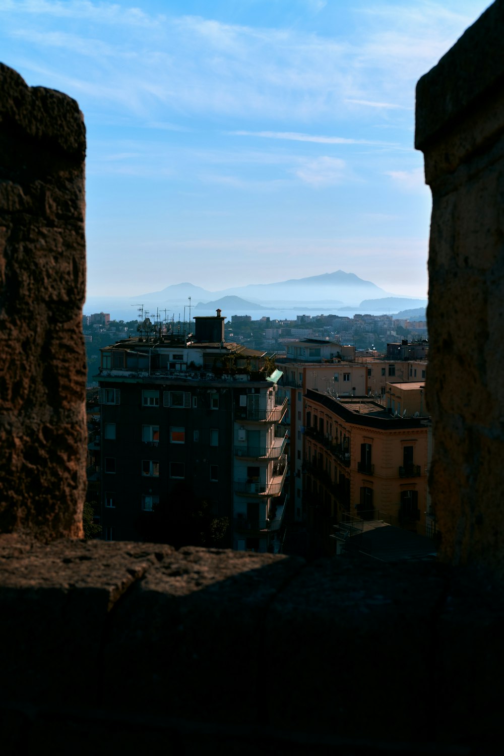 a view of a city from a window in a building