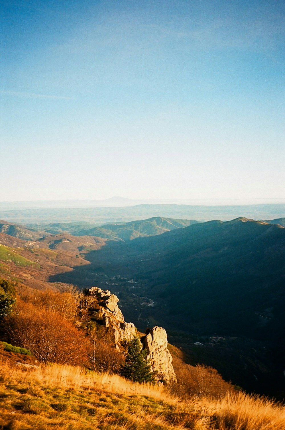 a view of a mountain range from a hill