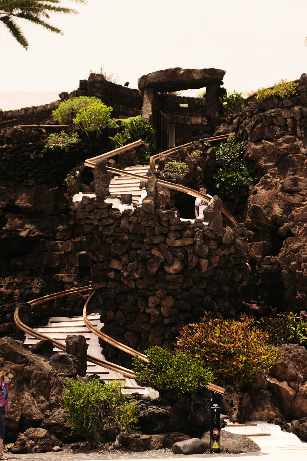 a group of people standing on a rocky hillside