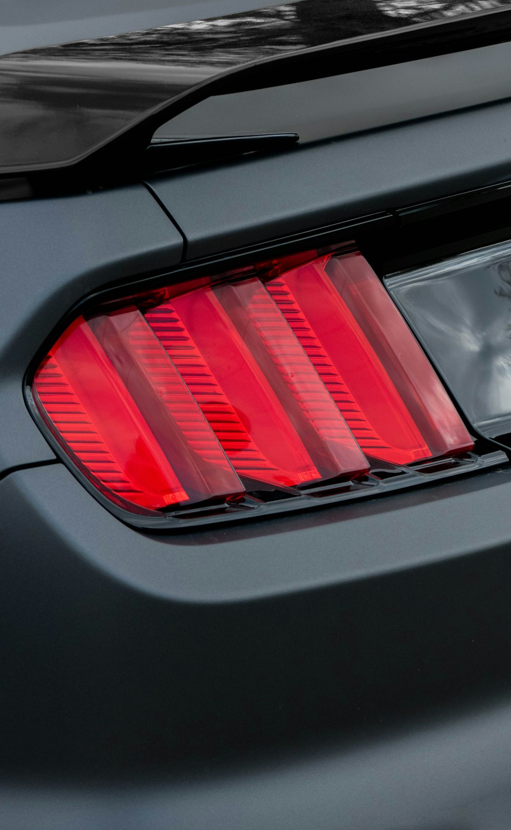 a close up of the tail lights of a sports car