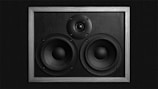 a pair of speakers in a metal frame