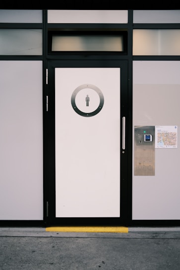 Modern public restroom entrance with a digital access system