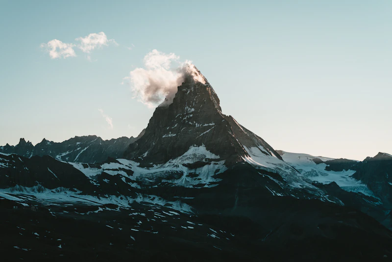 A wisp of cloud trailing from the summit of the Matterhorn above Zermatt
