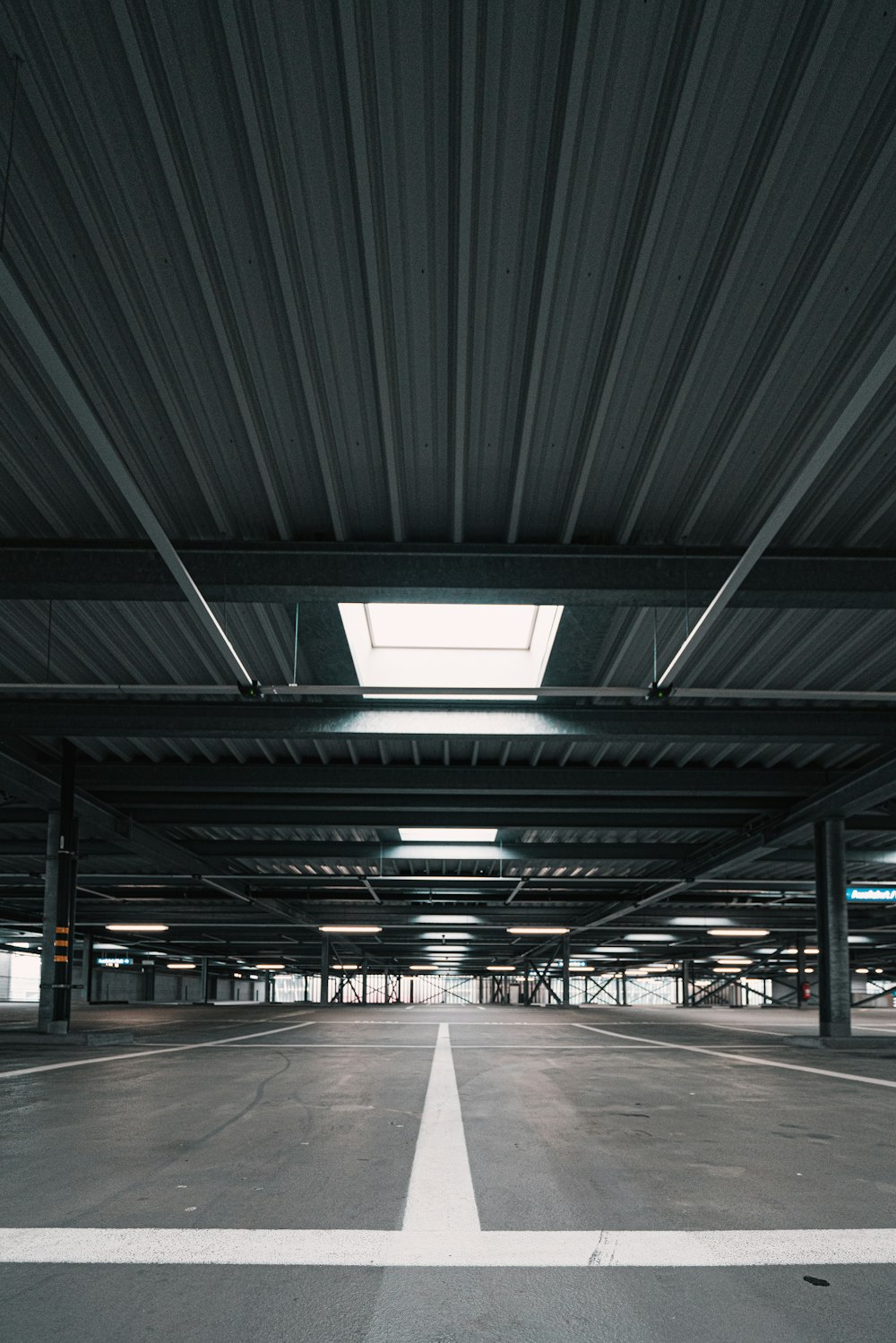 an empty parking garage with a skylight above it