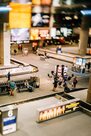 A welcoming airport arrival scene with travelers and luggage.