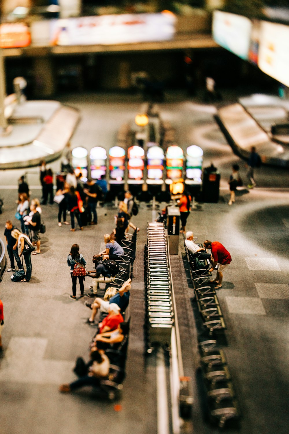 a group of people standing around a train station