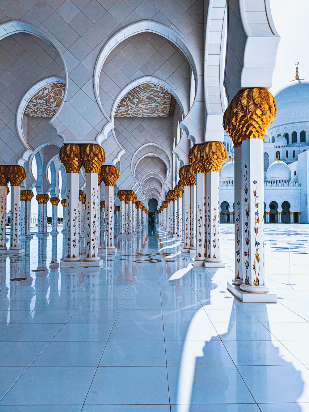 a large room with a lot of columns and lights