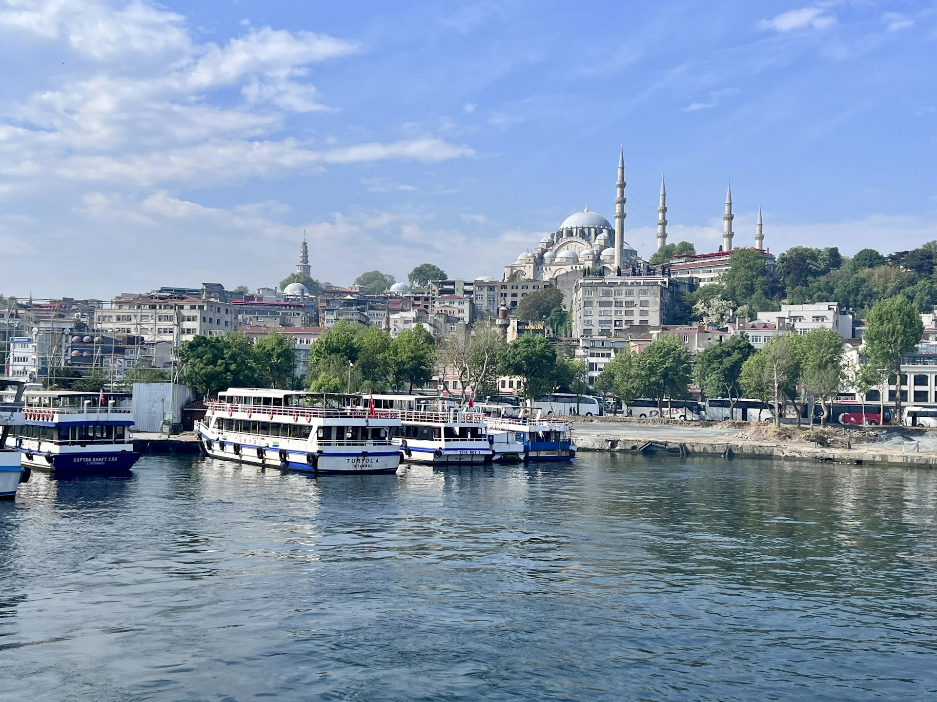 woman wearing yellow long-sleeved dress under white clouds and blue sky during daytime