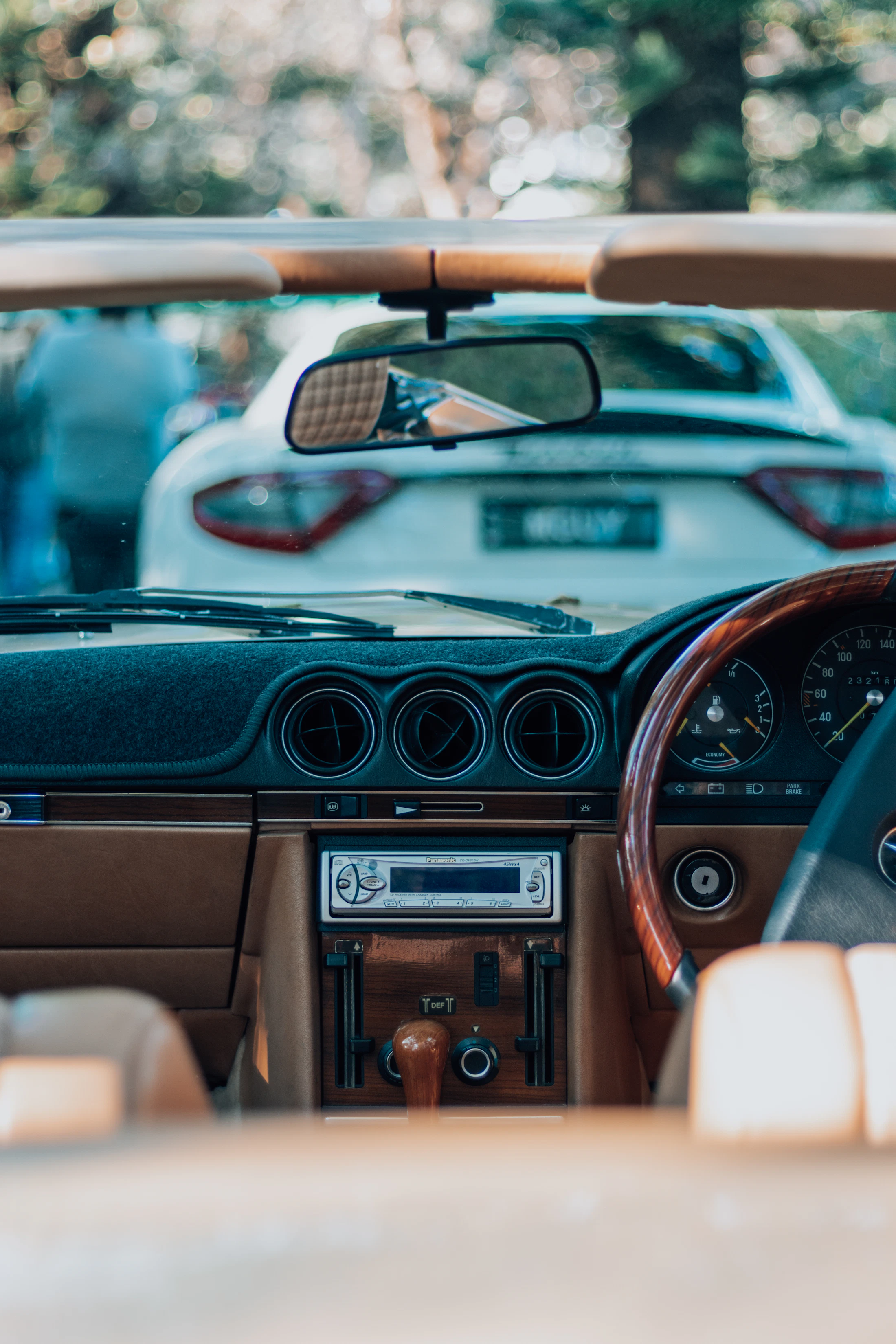View from inside a vehicle showing the dashboard and everyday driving environment