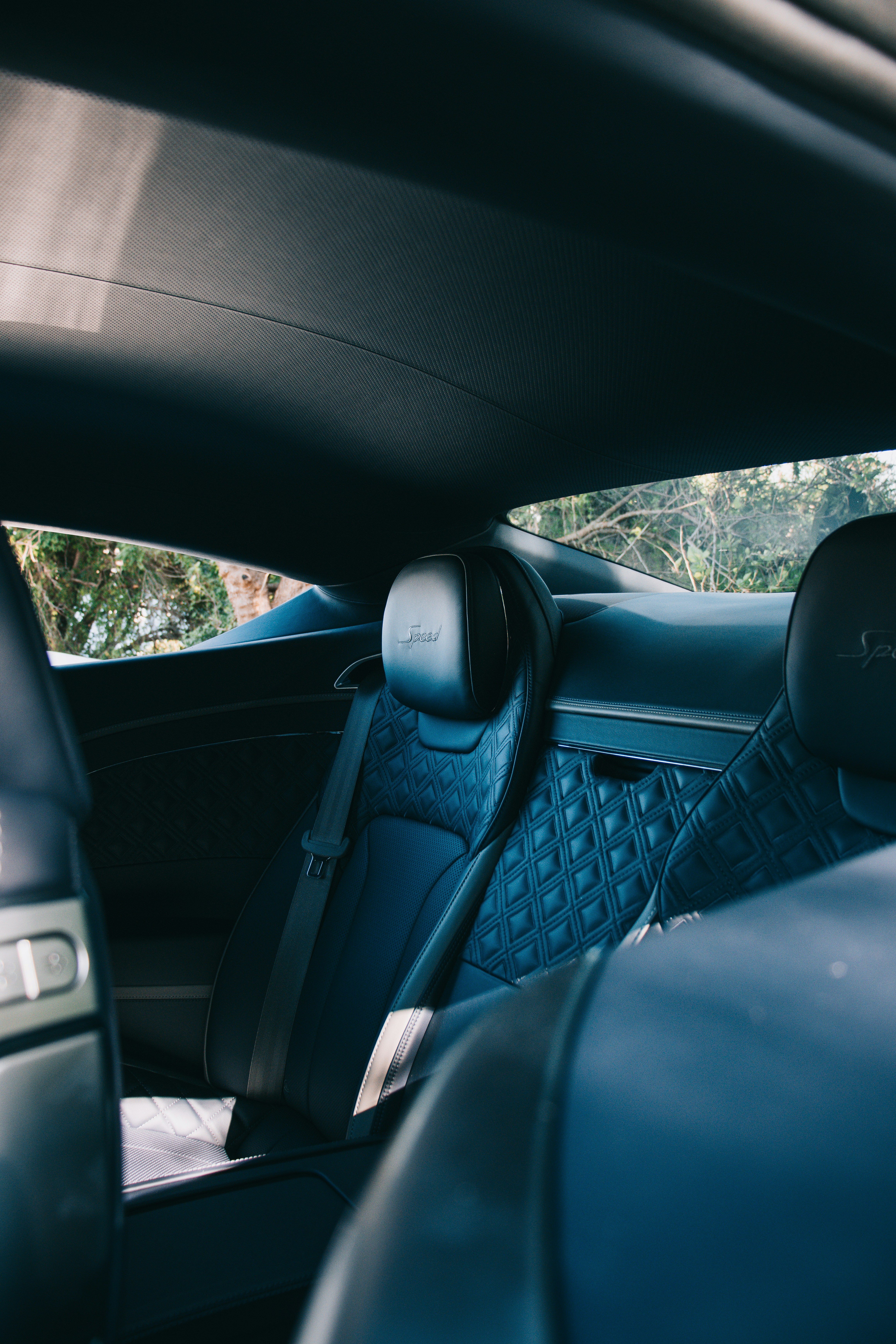 the interior of a car with blue leather seats