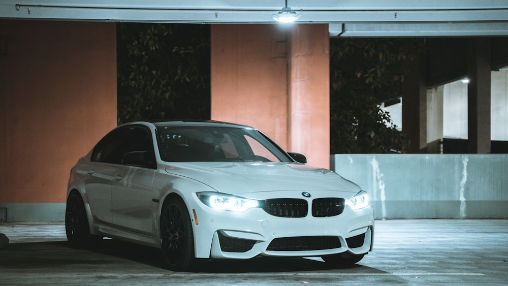 a white car parked in a parking garage