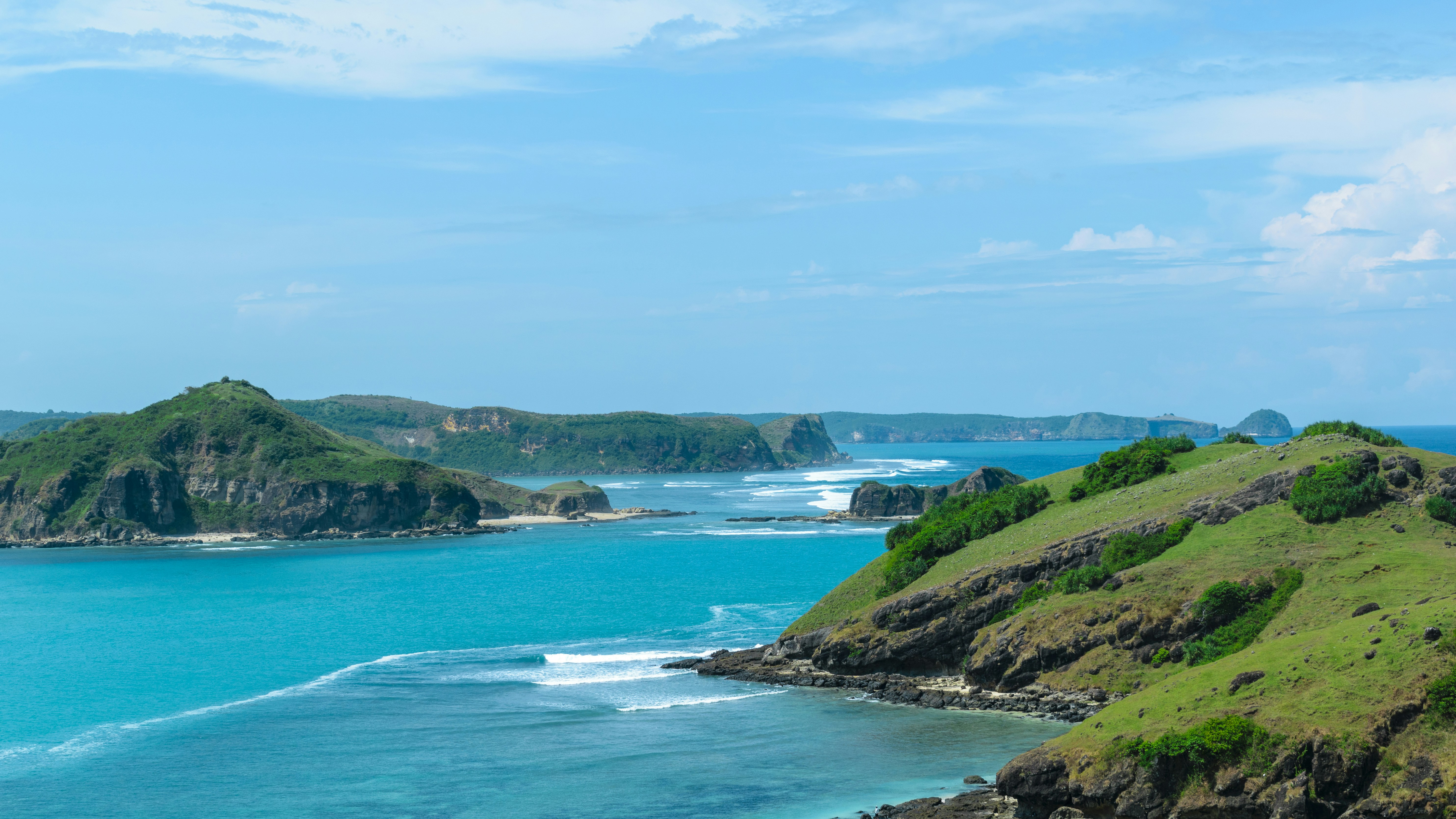 a view of the ocean from a hill