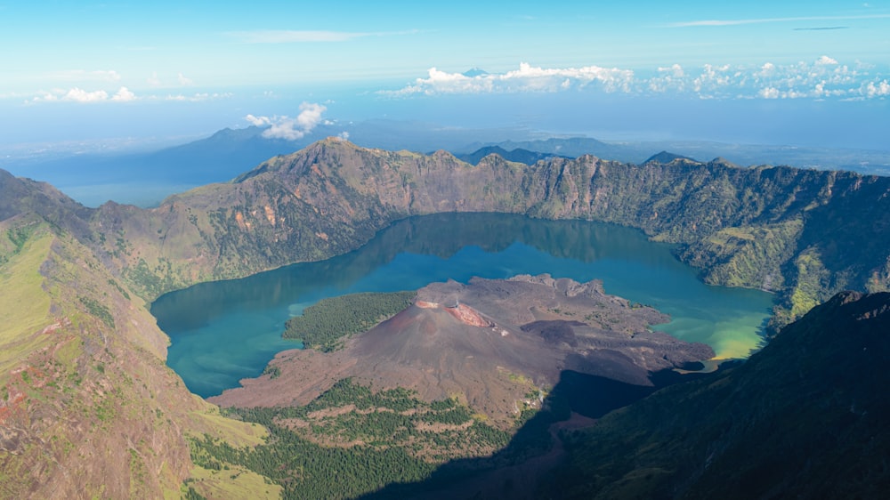 a view of a mountain range with a lake in the middle