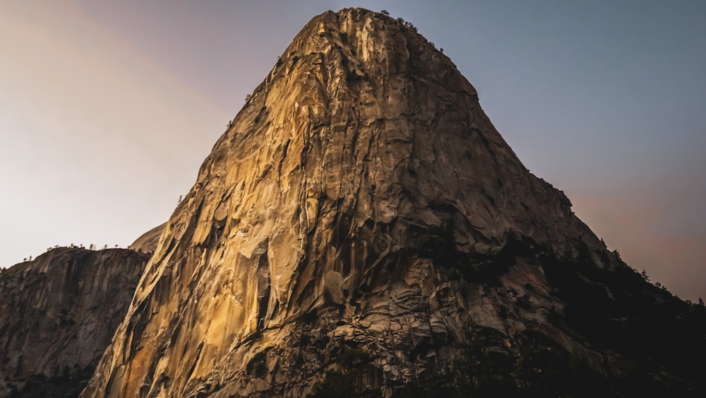 a very tall mountain with a sky background