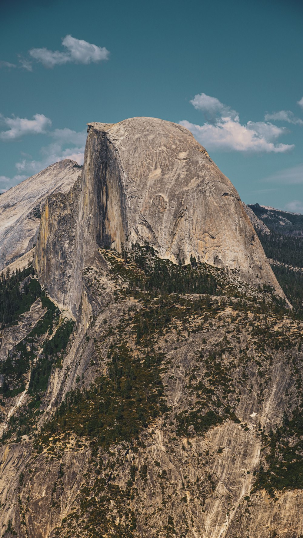 a view of the top of a mountain with a sky background