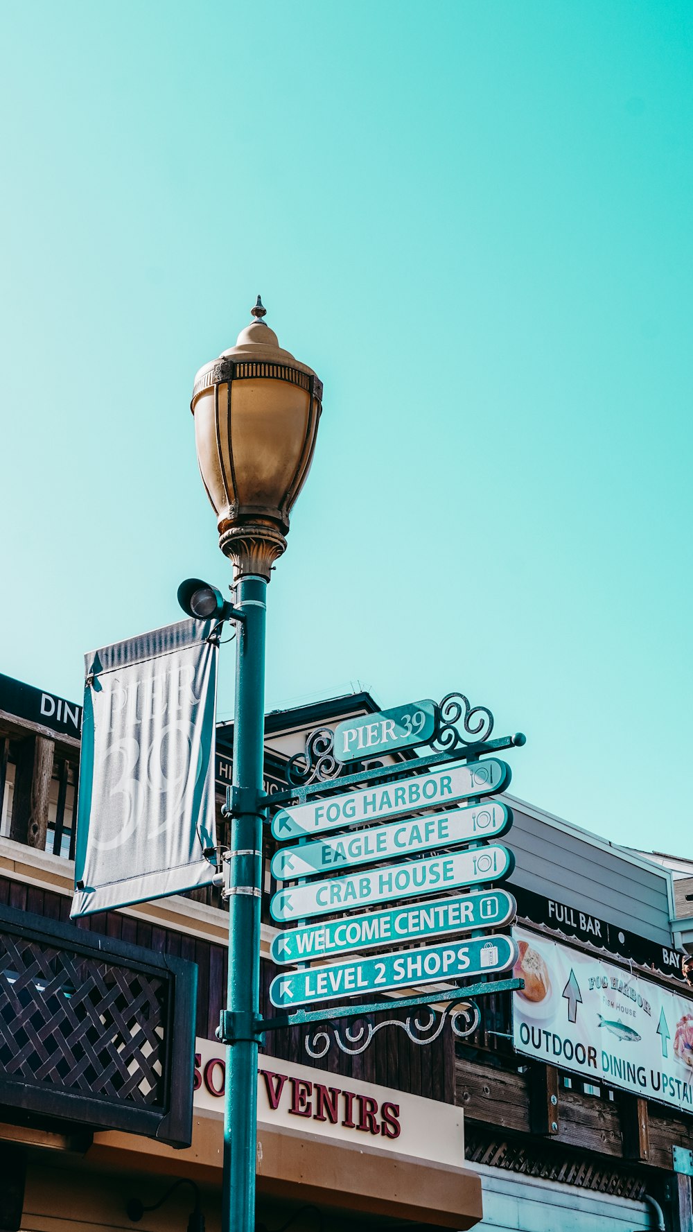 a pole with a bunch of street signs on it