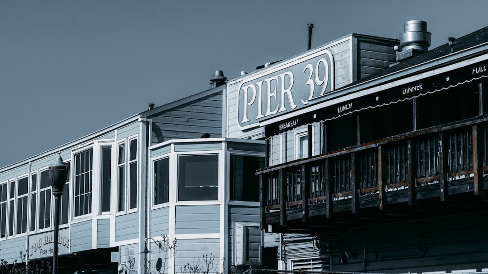 a black and white photo of a pier building