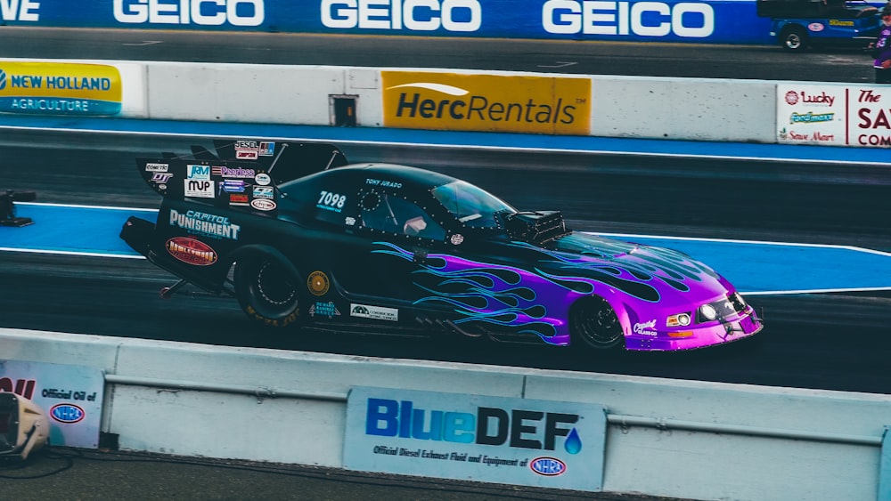 a drag car driving on a race track
