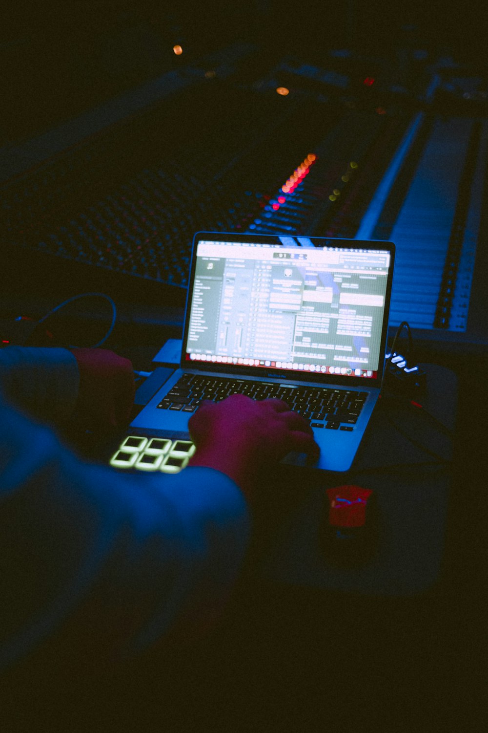 a person sitting in front of a laptop computer