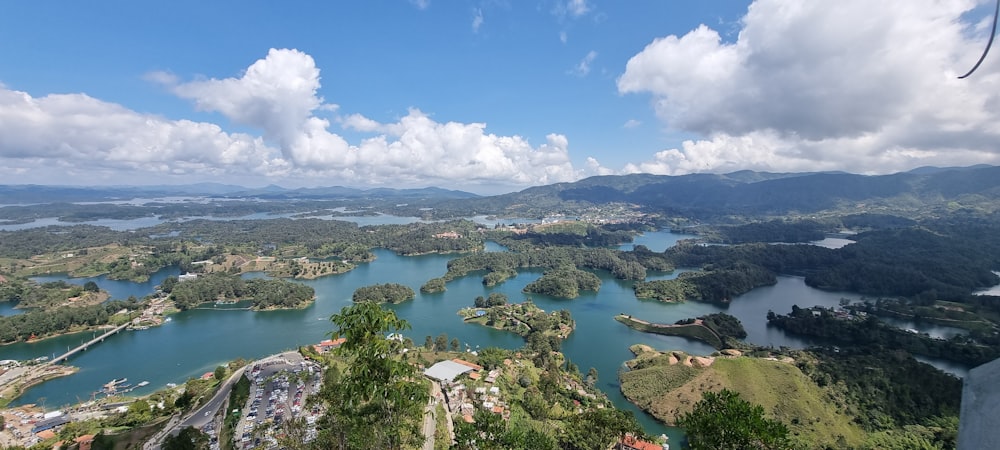 an aerial view of a lake surrounded by mountains