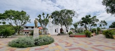 a large white building with a statue in the middle of it