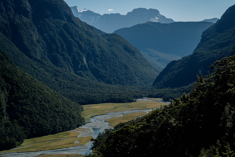 a view of a valley with mountains in the background