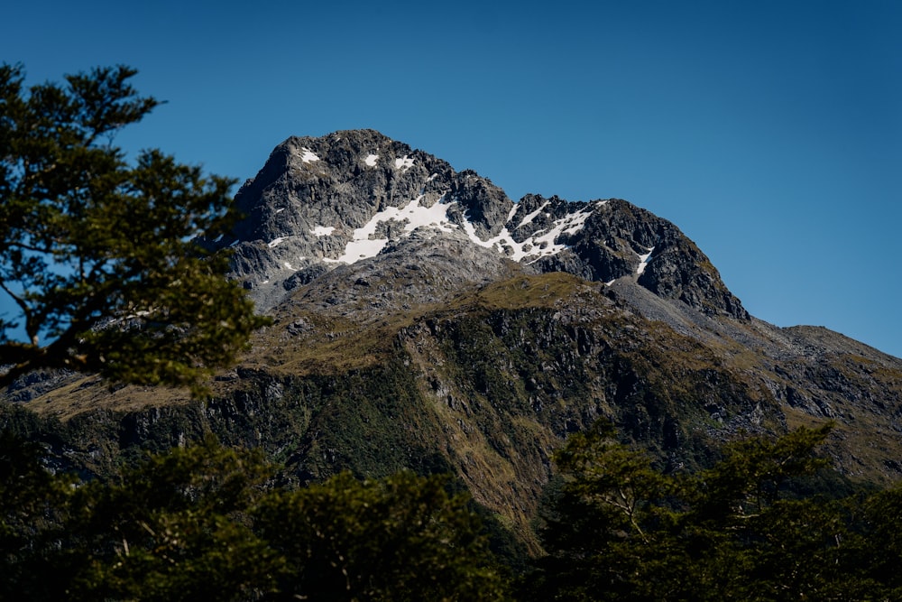 a large mountain with a snow covered top