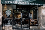 a starbucks coffee shop with a person sitting at a table