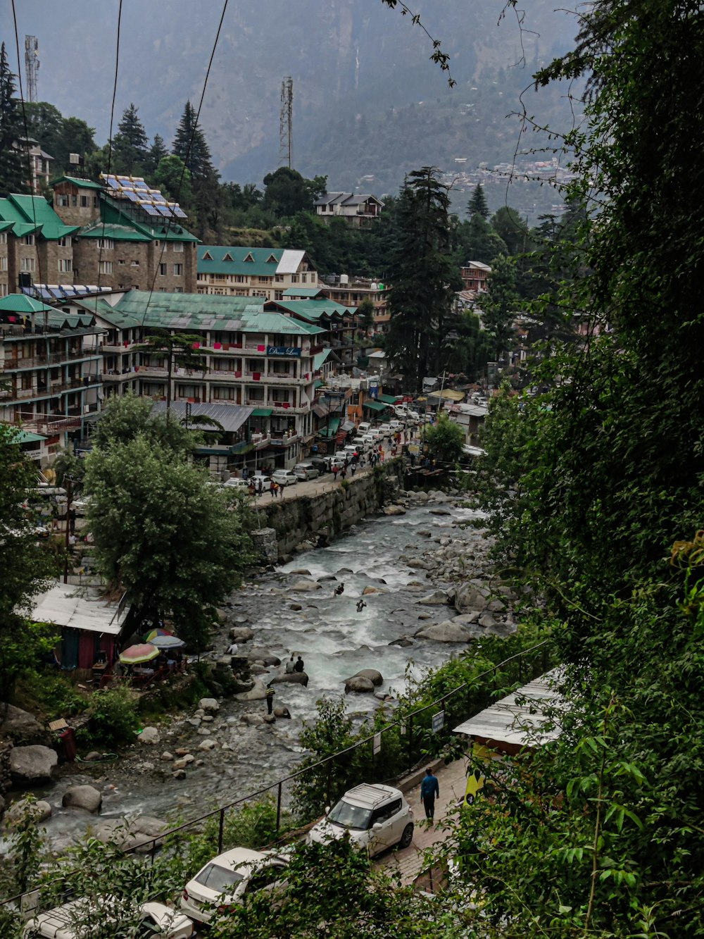 a river running through a lush green hillside