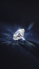 A sparkling diamond on a black background.