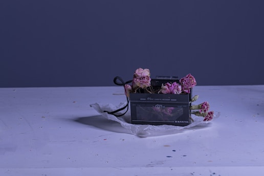 a bunch of flowers sitting on top of a white table