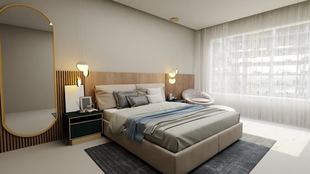 a bedroom with a large bed and a large mirror