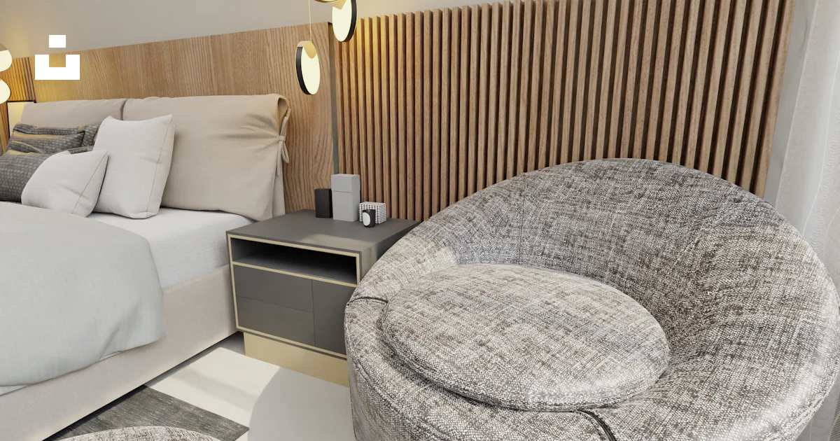 Una habitación con una cama bien hecha y una silla foto – Imagen de ...