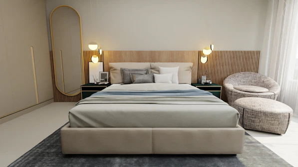 a large bed sitting in a bedroom next to a chair